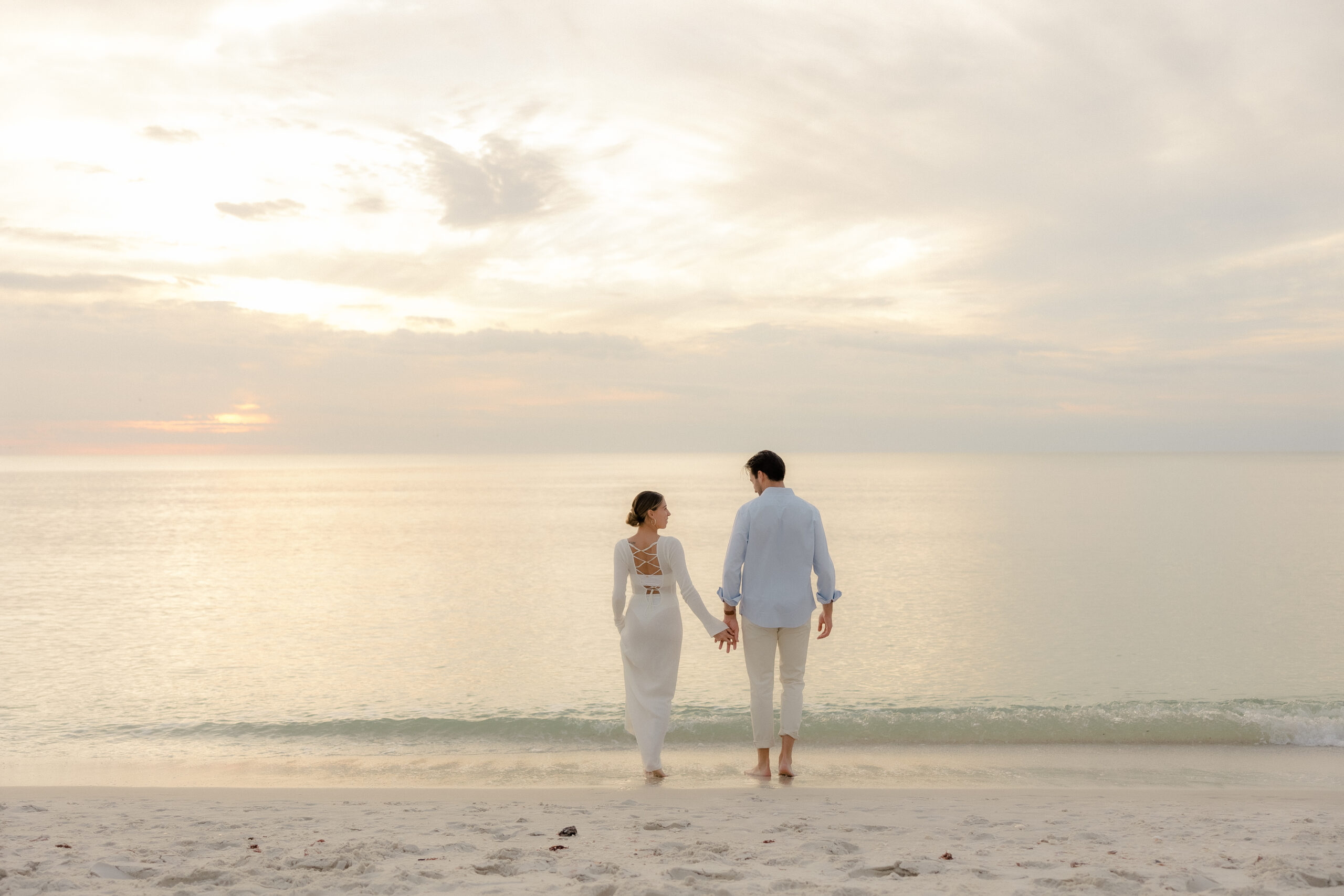 walking down the beach in naples florida after proposal.