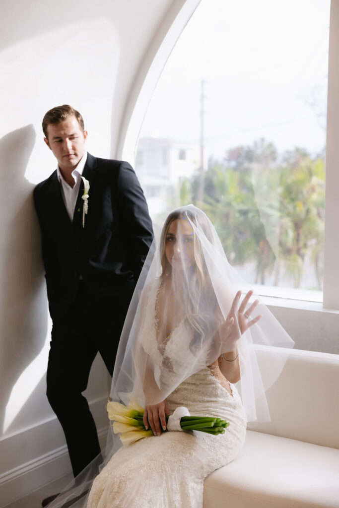 Bride and Groom showing off elegance at rooftop wedding.