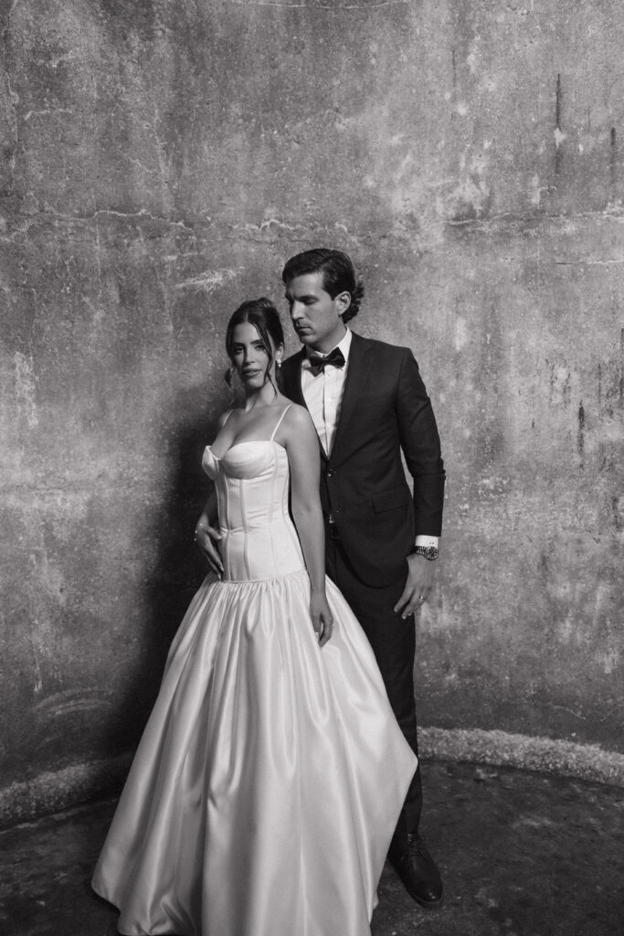 Couple embracing during their Uliana Estate wedding captured by Florida destination wedding photographer